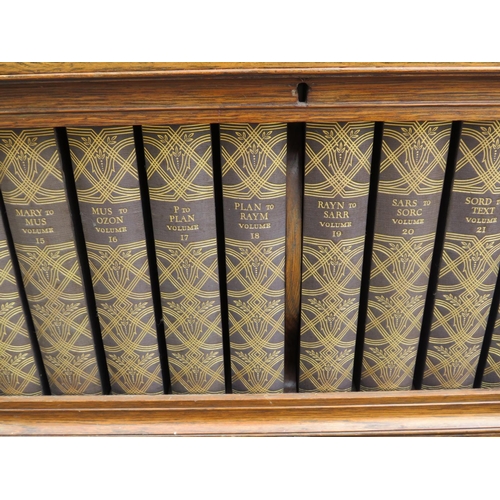 566 - Double fronted drop door bookcase, purposely built and containing 24 editions of the 1929 Encycloped... 