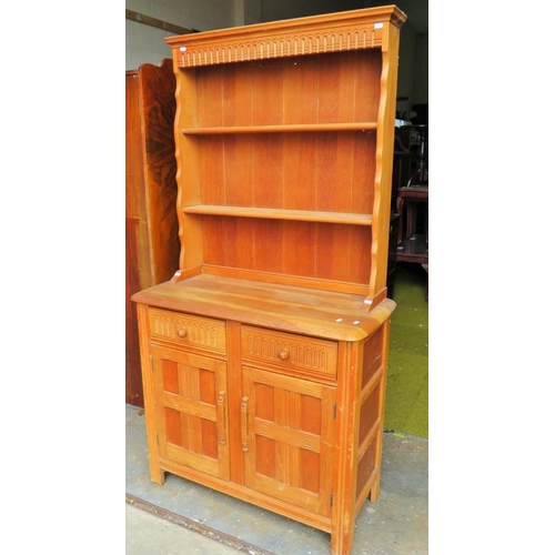 574 - Pleasing light wood dresser with plate rack above. H:68 X W:36 X D:16 inches. See photos.