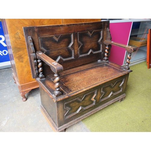 579 - Tudor Style dark oak Monks bench which converts to side table . H:29 X W:41 X D:19 inches . See phot... 