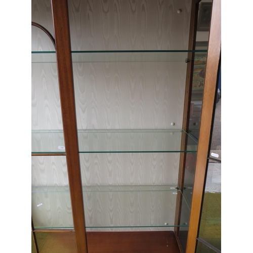 580 - Large glass fronted/glass sided display cabinet with three glass shelves and storage under. Fitted w... 