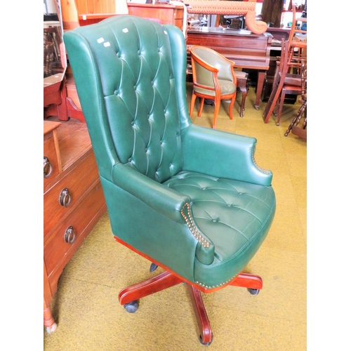 592 - Office chair upholstered in soft green leather in the Chesterfield style. Adjustable height and runs... 