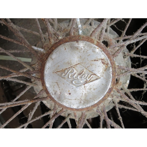 612 - Four Vintage Riley car wheels and tyres. Overal poor condition, for restoration or Decoration only