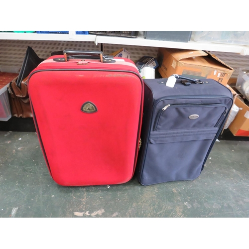 893 - Two Good quality wheeled airport style luggage cases. see photos.