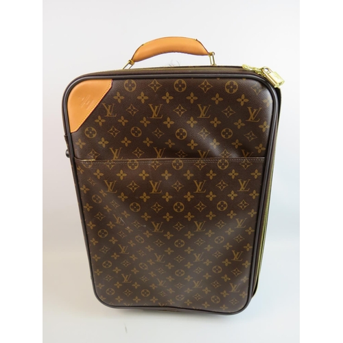 894 - Wheeled luggage bag in the style of Louis Vuitton. Originality not known. please study photographs.