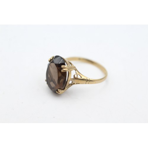 62 - 9ct gold smoky quartz cocktail ring (2.4g)       107359