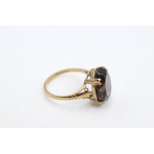 62 - 9ct gold smoky quartz cocktail ring (2.4g)       107359