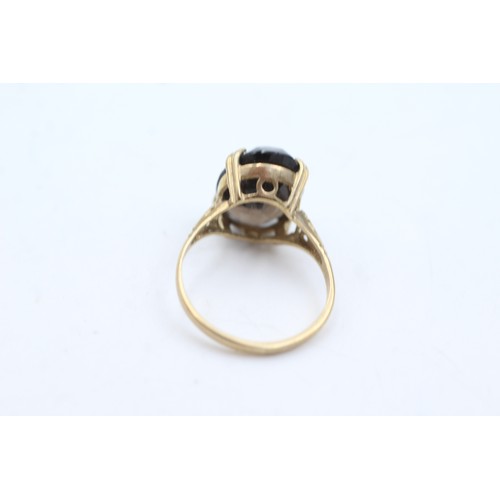 62 - 9ct gold smoky quartz cocktail ring (2.4g)       107359