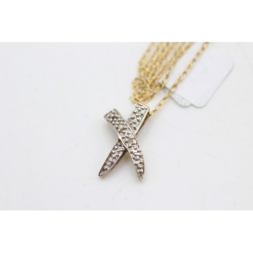 73 - 9ct gold diamond cross pendant necklace (1.5g)       914421