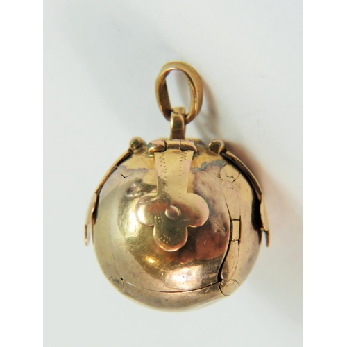 116 - Unmarked, believe to be 9ct Gold Masonic Orb folding ball pendant.  See photos.