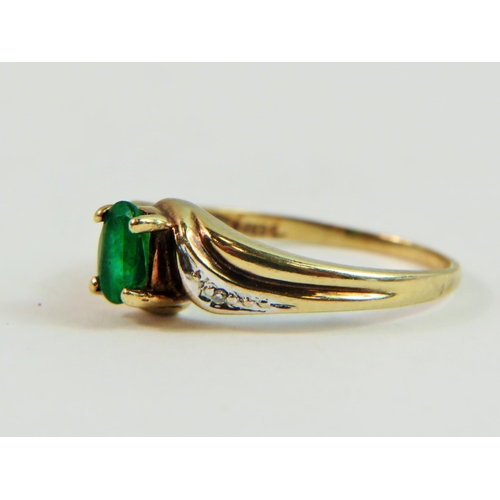 132 - Pretty, 9ct Yellow Gold ring set with a Central Oval Emerald with Diamonds to accompany.   Finger si... 