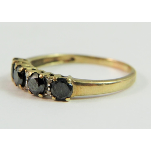 135 - 9ct Yellow Gold ring set with Four circular deep colour Sapphires, each separated by twin Melee Diam... 