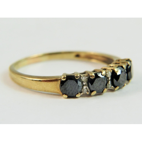 135 - 9ct Yellow Gold ring set with Four circular deep colour Sapphires, each separated by twin Melee Diam... 