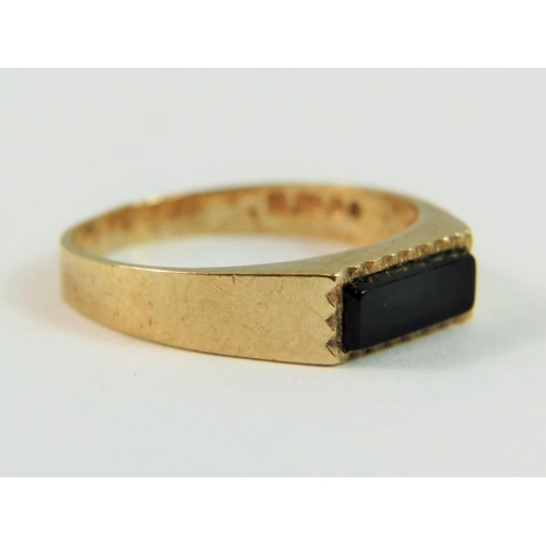 143 - 9ct Yellow Gold ring set with an oblong shaped Black Onyx.  Finger size 'L'   1.4g