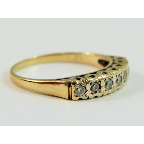 144 - 9ct Yellow Gold set with seven Diamonds of approx 0.25pts.   Finger size 'Q-5'   2.5g