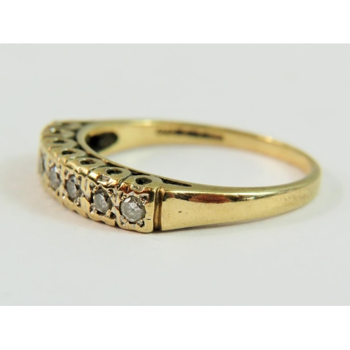 144 - 9ct Yellow Gold set with seven Diamonds of approx 0.25pts.   Finger size 'Q-5'   2.5g