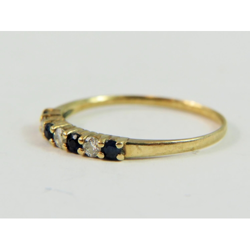 146 - 9ct Yellow Gold ring set with Three Diamonds and Four Sapphires.   Finger size 'N-5'   1.0g