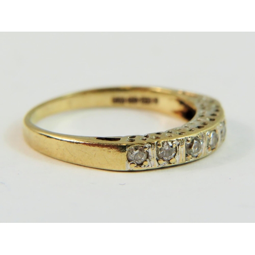 147 - 9ct Yellow Gold ring set with seven Diamonds of approx 0.25pts   Finger size 'N-5'   1.9g