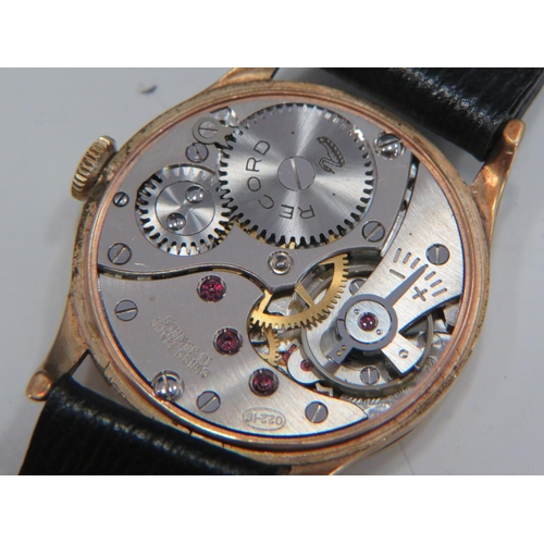 173 - Record 'Geneve' 15 Jewel Gents watch with 9ct gold case, leather strap and original box. Running ord... 