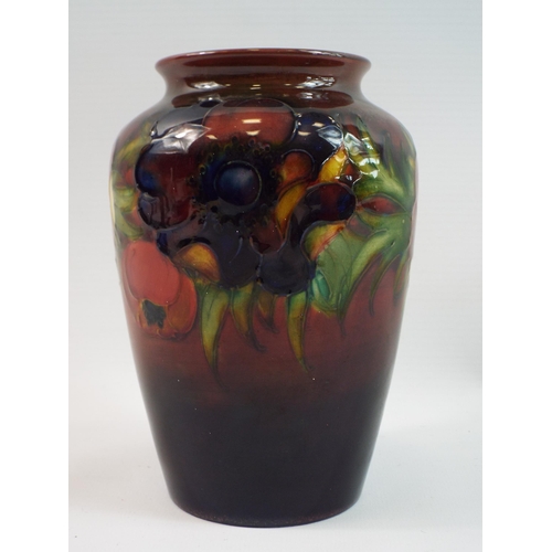 201 - Moorcraft 1950s poppy pattern vase 15cm tall, signed to the base.