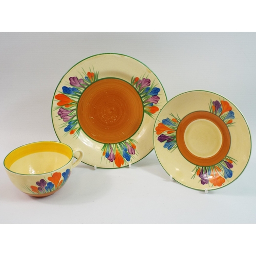 217 - Clarice cliff Crocus pattern trio. Very minor chip to rim of the saucer.