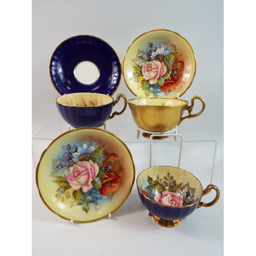 240 - 2 X Aynsley Cabbage Rose cabinet cups and saucers, signed J A Bailey. Plus one Orchard gold cup and ... 