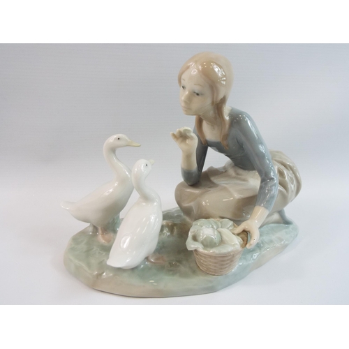 276 - Nao Lladro figurine of a girl feeding ducks.