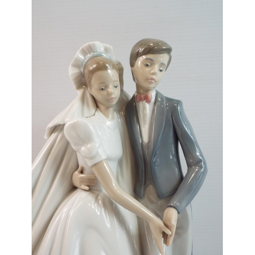 284 - Large Nao figurine of a bride and groom 