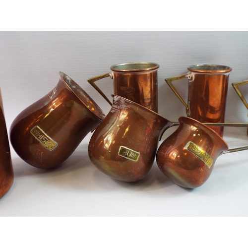 313 - Selection of copper measuring vessels.