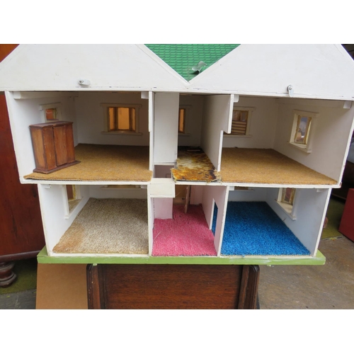 508 - Mid 20th Century dolls house in the Mock Tudor style. Measures H:22 x W:31 inches. See photos