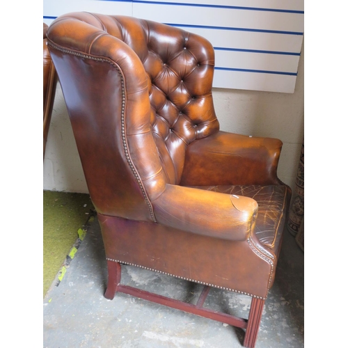 510 - Vintage Leather Chesterfield High backed chair. In nicely worn condition with some patched re-enforc... 