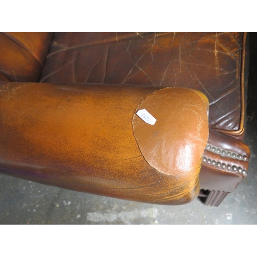 510 - Vintage Leather Chesterfield High backed chair. In nicely worn condition with some patched re-enforc... 