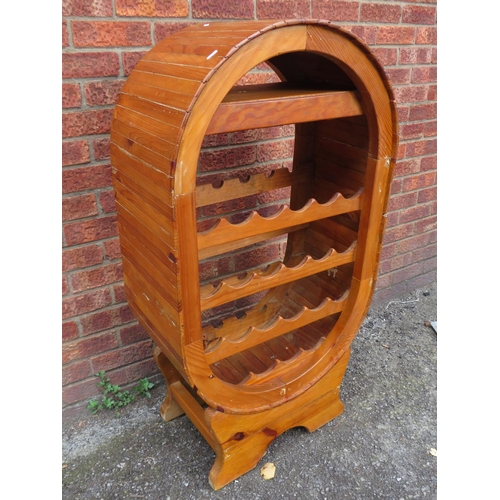 513 - Nicely made pine wine rack of domed pine construction. H:48 X W:25 X D:15 inches. See photos.