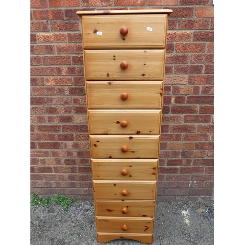 520 - Pine effect nine drawer chest with solid pine drawer fronts and top.  H:58 x W:17 X D:16 inches. See... 