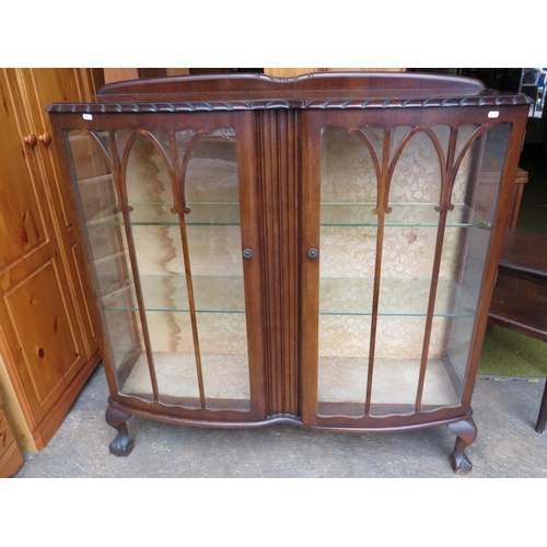 522 - 1930's Serpentine fronted glass china cabinet raised on cabriole legs and ball & Claw feet. Two adju... 