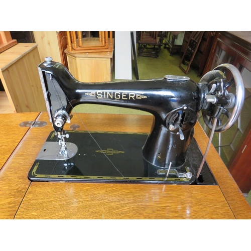 524 - Vintage Singer Treadle Sewing machine with original cabinet. Appears to be in working order. See pho... 