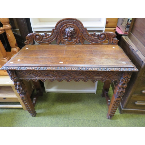 536 - Interesting antique oak hall table with lots of decorative carving to legs, apron and head. H:30 X W... 