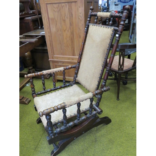 539 - Antique dark wood spring loaded American style rocking chair. See photos.