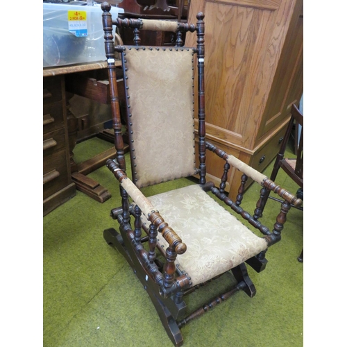 539 - Antique dark wood spring loaded American style rocking chair. See photos.