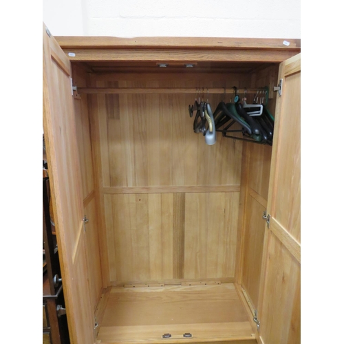 545 - Good quality light oak wardrobe with blanket drawer under. Double fronted doors with hanging rail wi... 