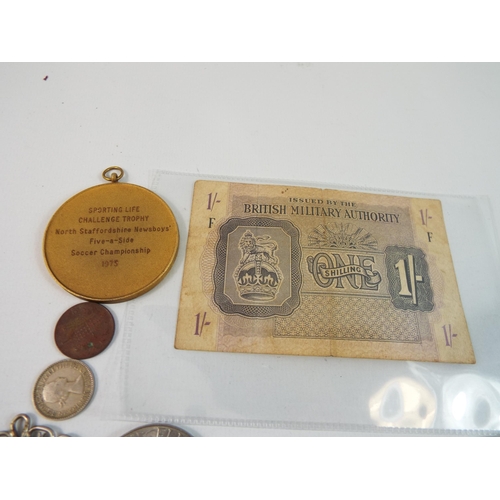 472 - A quantity of coins, medallions and a british military 1 shilling note.