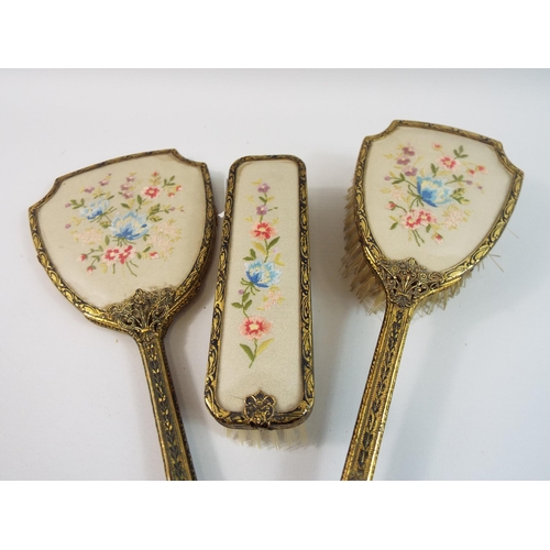 473 - Vintage dressing table grooming set, gilt metal and floral embroidery.