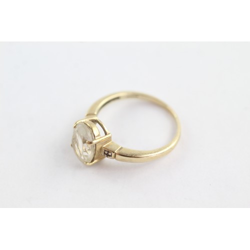 673 - 9ct gold diamond and rutile quartz trilogy ring (3g)     752656