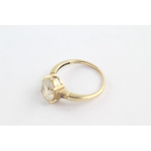 673 - 9ct gold diamond and rutile quartz trilogy ring (3g)     752656