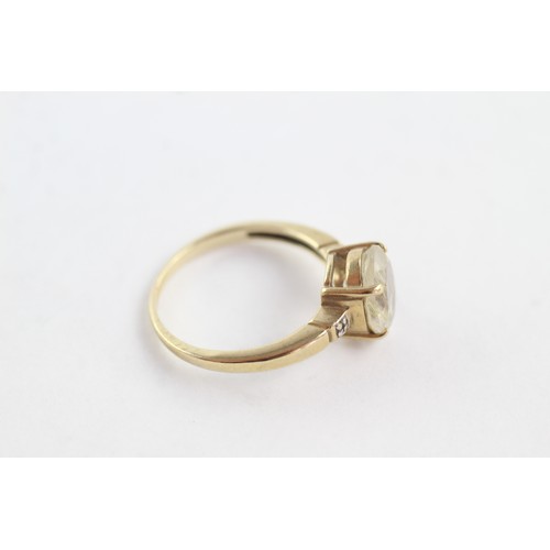 673 - 9ct gold diamond and rutile quartz trilogy ring (3g)     752656