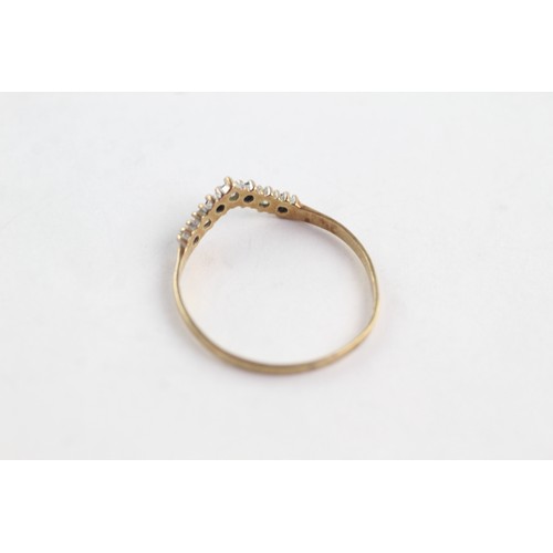 687 - 9ct gold sapphire and clear gemstone wishbone ring (0.9g)     752649