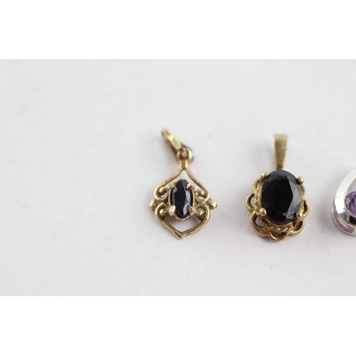 709 - 4 x 9ct yellow & white gold gemstone pendants inc. sapphire, amethyst & quartz (2.3g)     752616