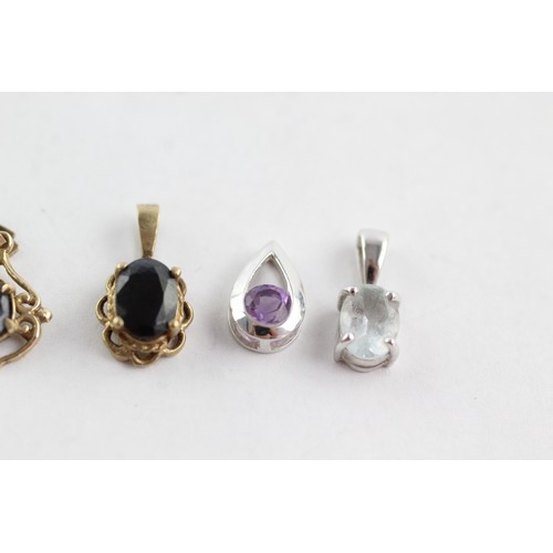 709 - 4 x 9ct yellow & white gold gemstone pendants inc. sapphire, amethyst & quartz (2.3g)     752616