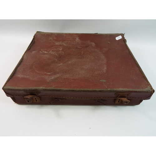 493 - Vintage leather case containing piano and sheet music.