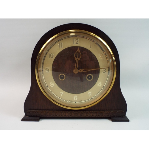 791 - Vintage British wooden mantle clock which appears to be in working order but requires a key.