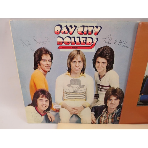 841 - Seven 1970's vinyl LP's, one signed by Bay City Rollers. . See photos.